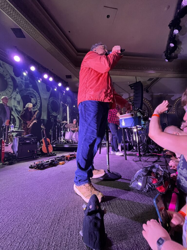 Portland, OR 6 June 2025. Zeke in rapture at the feet of John Flansburgh